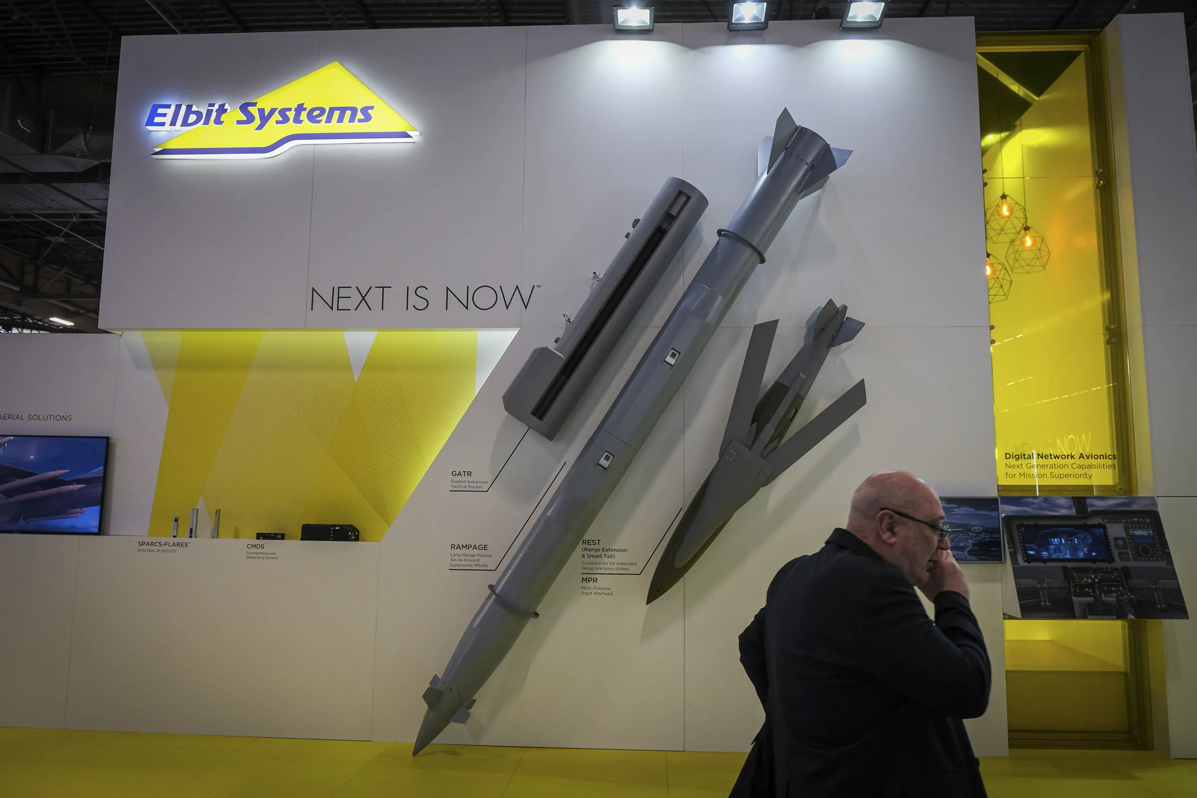 Missiles and rockets displayed diagonally on a corporate exhibition wall