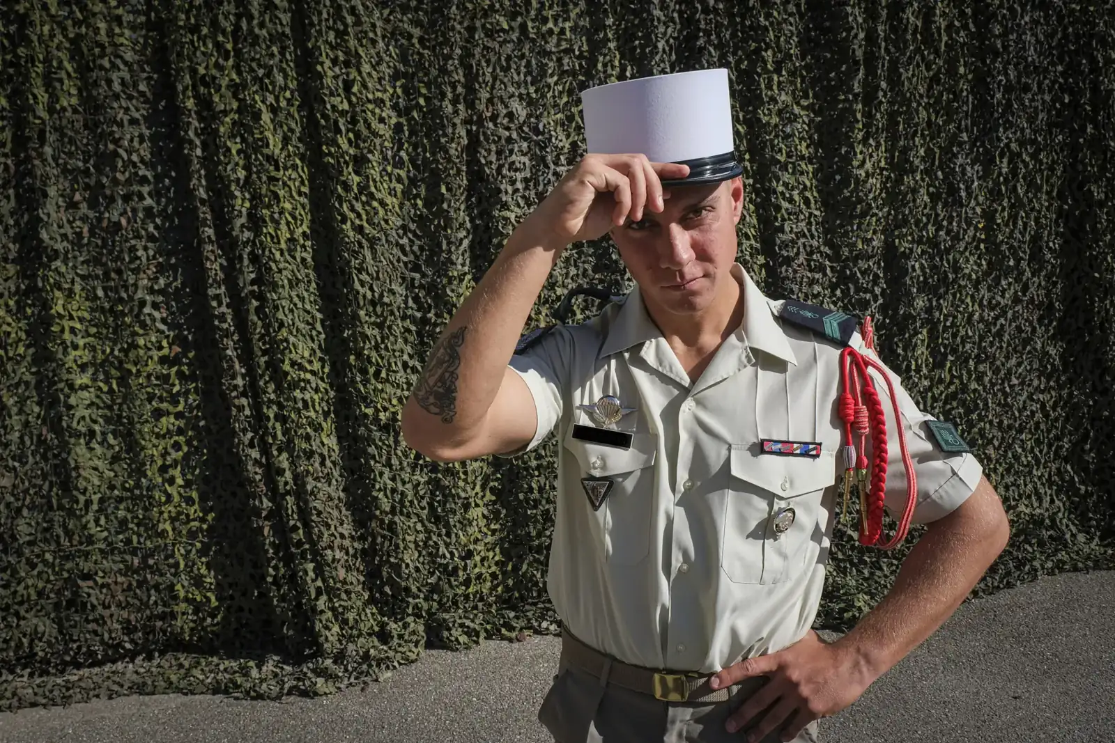 Alban, a French legionnaire newly promoted to corporal, tipping his white képi