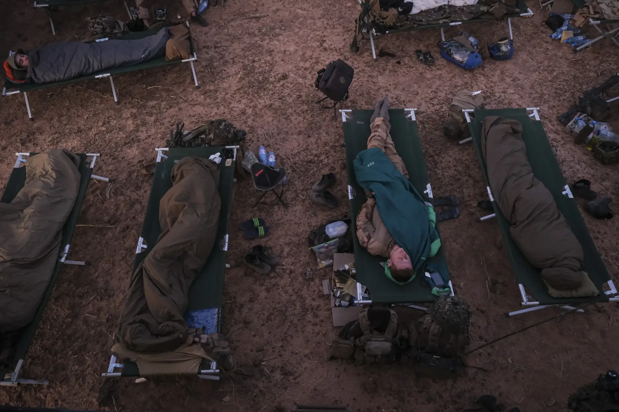 French paratroopers sleep on cots in the desert during Barkhane Operation, April 2021