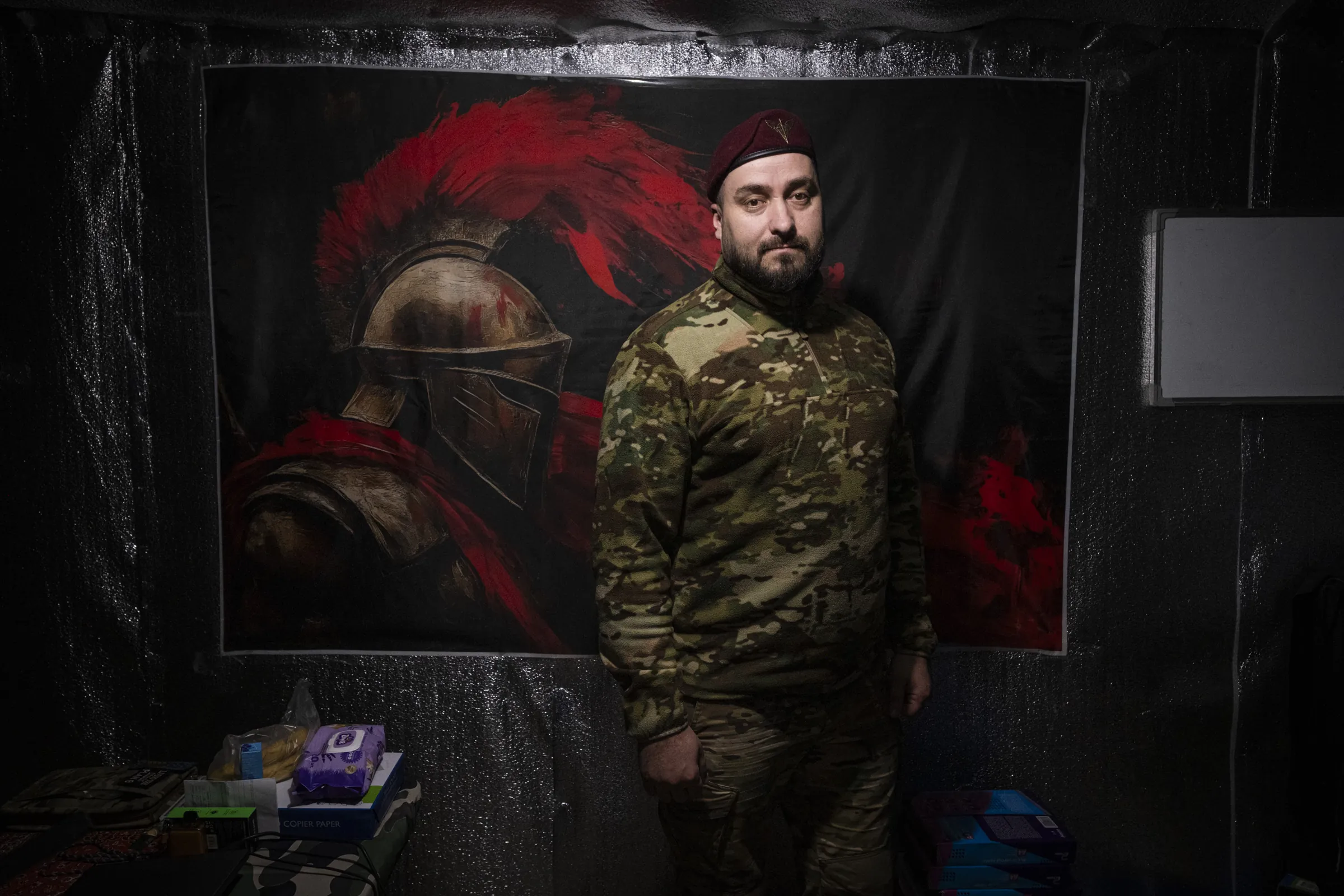 The commander of a frontline unit near Pavlograd, in his dugout command post